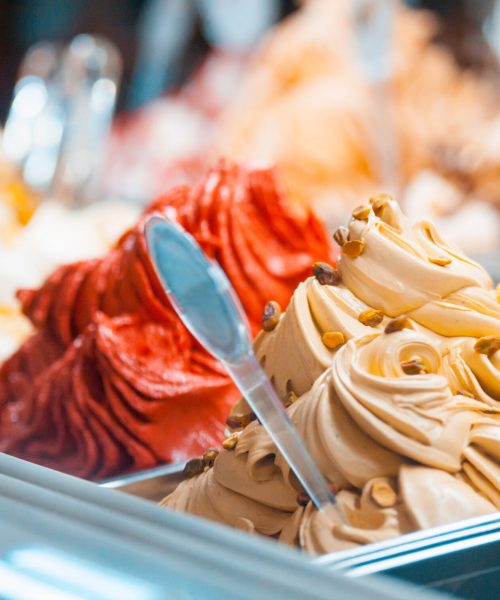 Ice cream in showcase fridge at confectionery shop